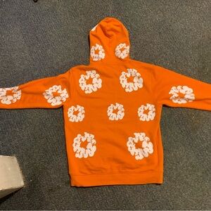 Vibrant Orange Men's Hoodie with Graphic Patterns